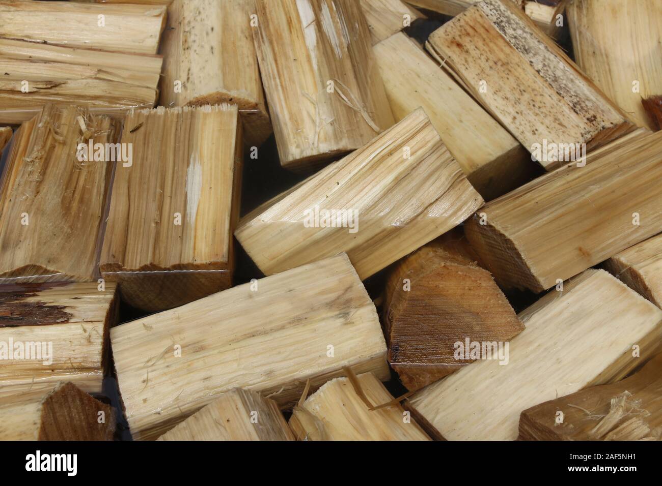 Poplar wood soak in the water before use it for Dutch Clogs Stock Photo