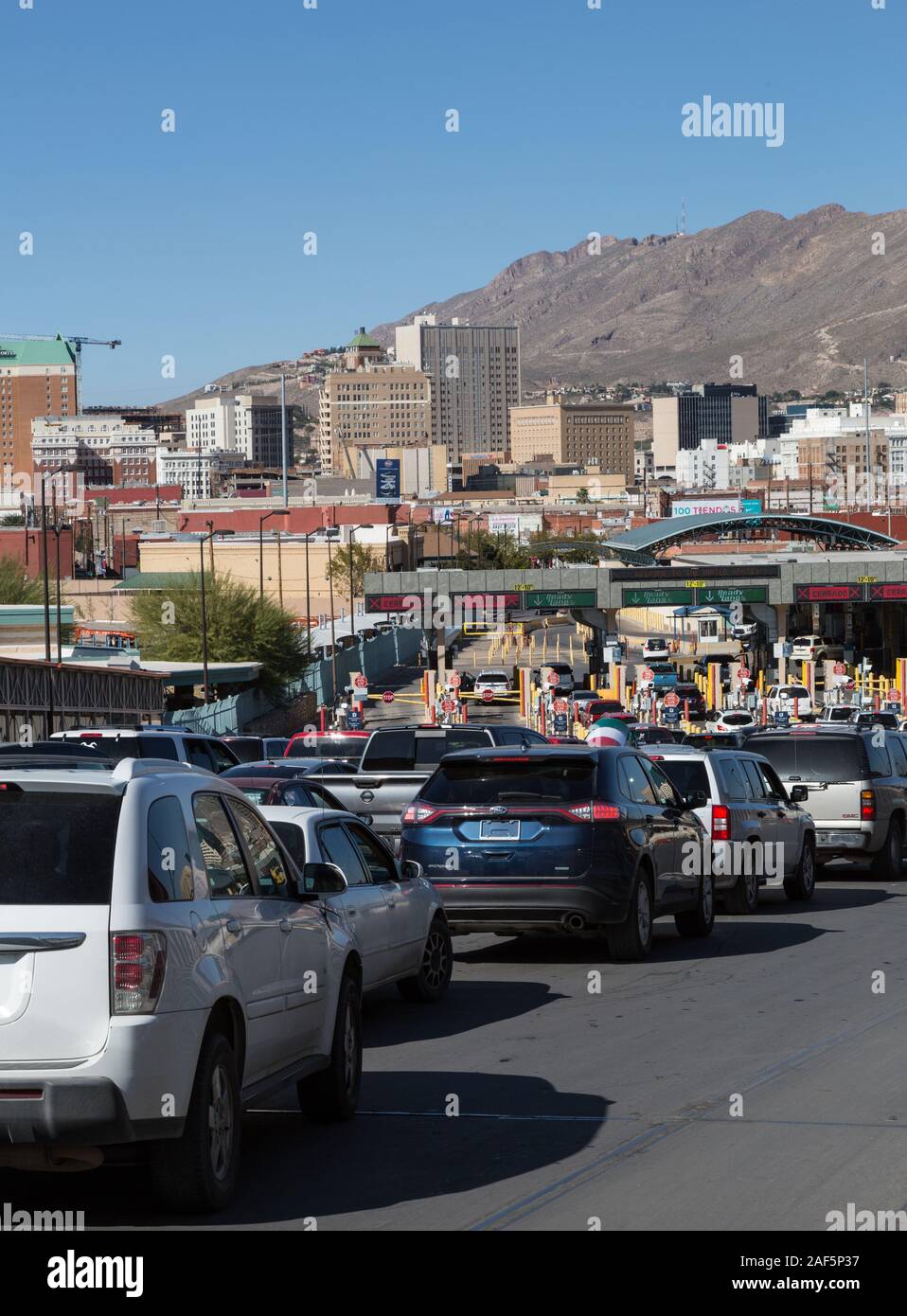 El Paso, Texas.  Automobiles Lined up to Enter the United States, Seen from Ciudad Juarez Side of the Border, Looking toward El Paso. Stock Photo