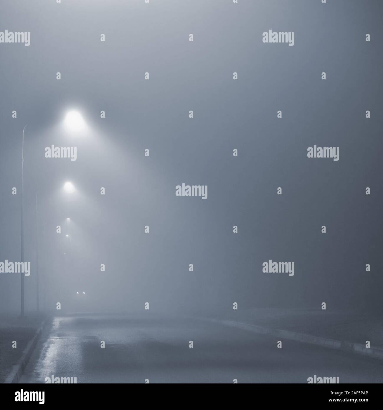 Street lights, foggy misty night, lamp post lanterns, deserted road in