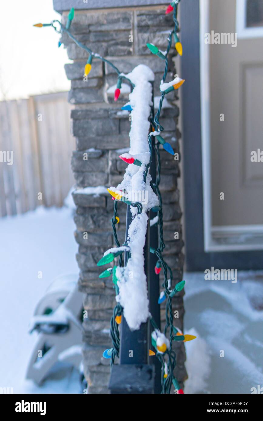 Christmas lights covered in snow oh house railings Stock Photo Alamy