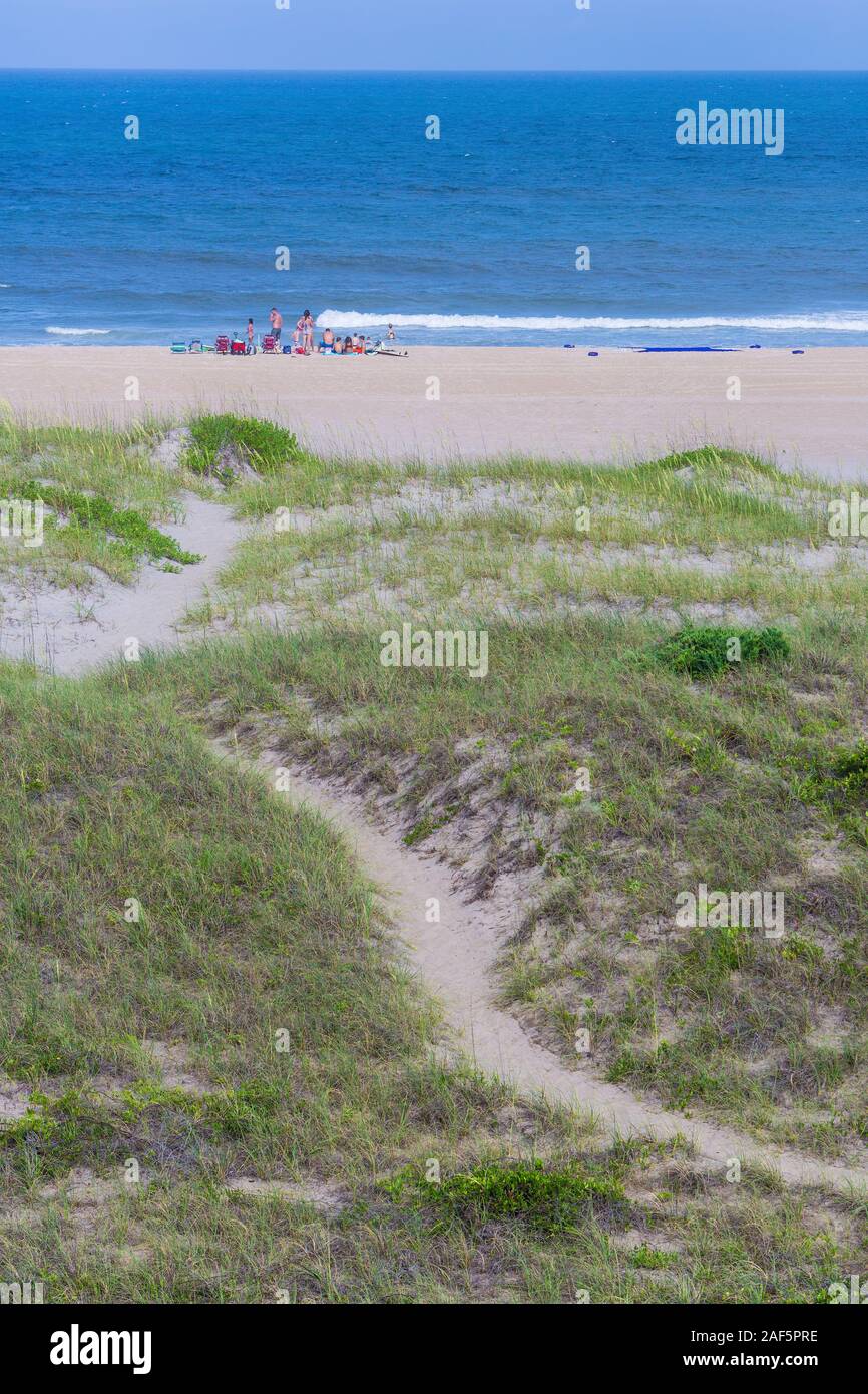 Avon, Outer Banks, North Carolina.  Pathway Leads to Family Gathering on the Beach.  Vegetation Stabilizes Dunes. Stock Photo