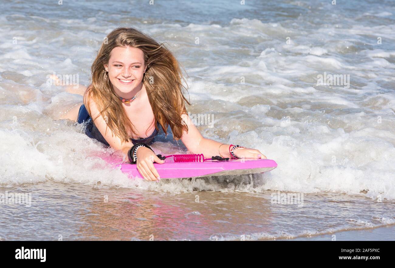 Avon, Outer Banks, North Carolina.  Teenage Girl Boogie Boarding. (Model Released) Stock Photo