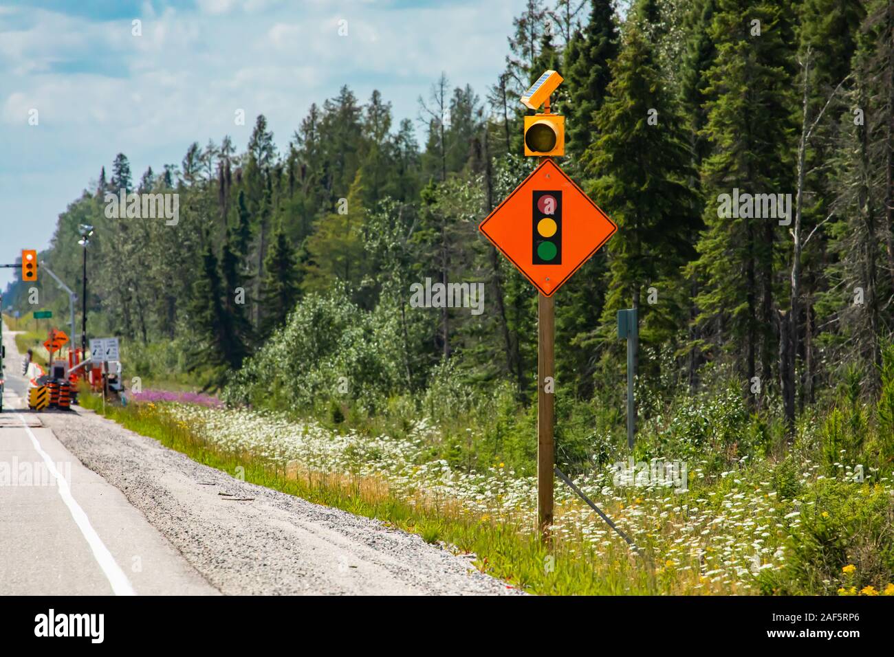 Temporary condition road warning signs on the roadside before road work