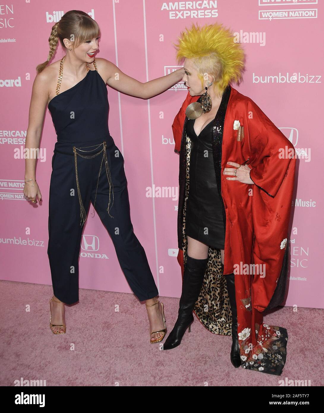 Los Angeles, USA. 12th Dec, 2019. (L-R) Taylor Swift and Cyndi Lauper at the 2019 Billboard Women in Music held at the Hollywood Palladium in Los Angeles, CA on Thursday, ?December 12, 2019. (Photo By Sthanlee B. Mirador/Sipa USA) Credit: Sipa USA/Alamy Live News Stock Photo