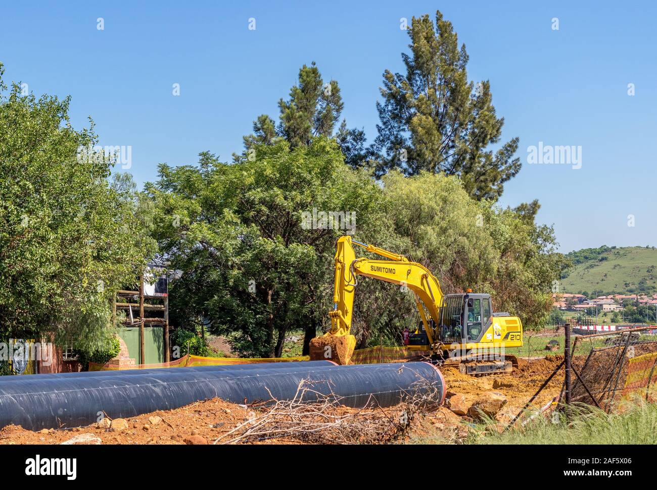 Alberton, South Africa - earthworks under way to instal an improved water distribution pipeline network image in horizontal format Stock Photo