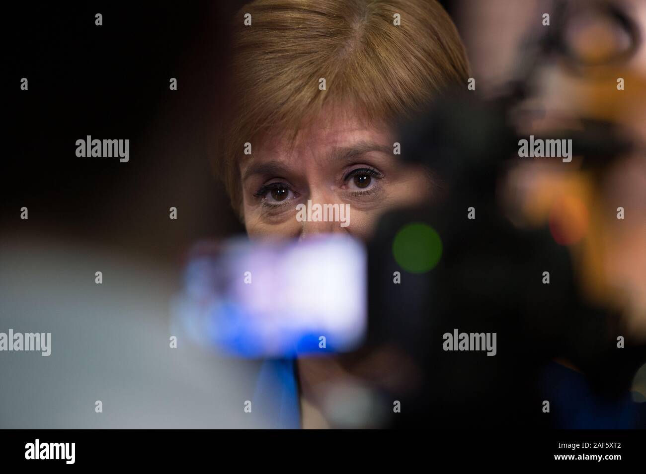 Glasgow, UK. 13th Dec, 2019. Pictured: (in blue) Nicola Sturgeon MSP - First Minister of Scotland and Leader of the Scottish National Party (SNP). Scenes from the vote count at the Scottish Exhibition and Conference Centre (SECC). The poles have now closed at 10pm and the vote count is now underway for the UK Parliamentary General Election 2019. This is the first time in almost 100 years that a general election has taken place in December. Credit: Colin Fisher/Alamy Live News Stock Photo