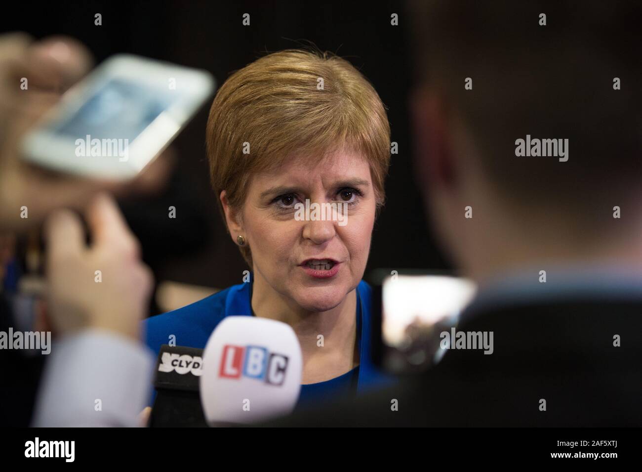 Glasgow, UK. 13th Dec, 2019. Pictured: (in blue) Nicola Sturgeon MSP - First Minister of Scotland and Leader of the Scottish National Party (SNP). Scenes from the vote count at the Scottish Exhibition and Conference Centre (SECC). The poles have now closed at 10pm and the vote count is now underway for the UK Parliamentary General Election 2019. This is the first time in almost 100 years that a general election has taken place in December. Credit: Colin Fisher/Alamy Live News Stock Photo