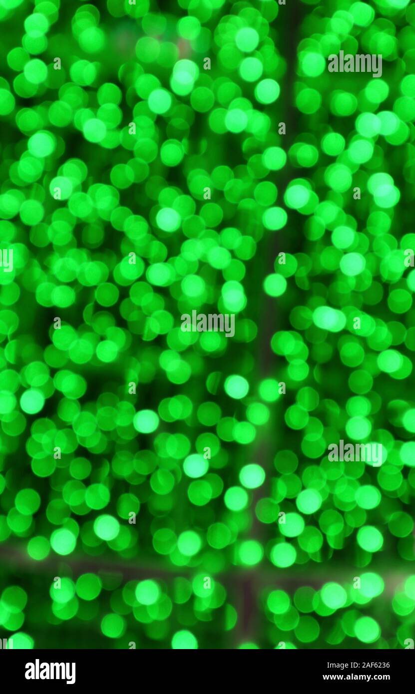 Vertical Image of Abstract Blurred Illuminated Green Lights Stock Photo