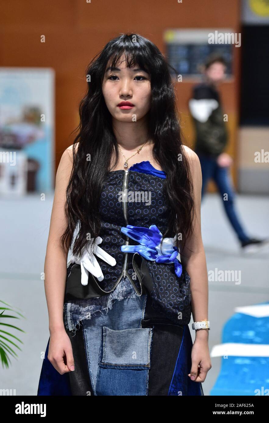 Madrid, Spain. 12th Dec, 2019. A model presents creations by Chinese  college students during a side event of the United Nations Climate Change  Conference (COP25) in Madrid, Spain, Dec. 12, 2019. The, image size:883x1390