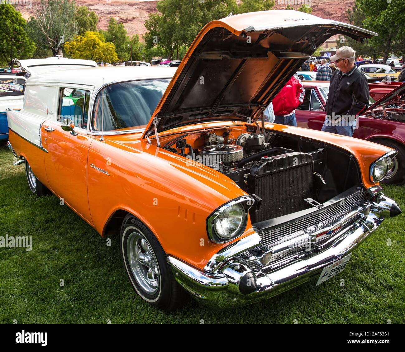 A modified 1957 Chevrolet Delivery Wagon called the Cream Sicle with a custom orange and white paint scheme in the  Moab April Action Car Show in Moab Stock Photo
