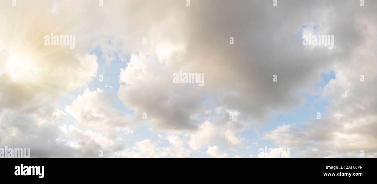 Clear blue sky with clouds and sun. Stock Photo