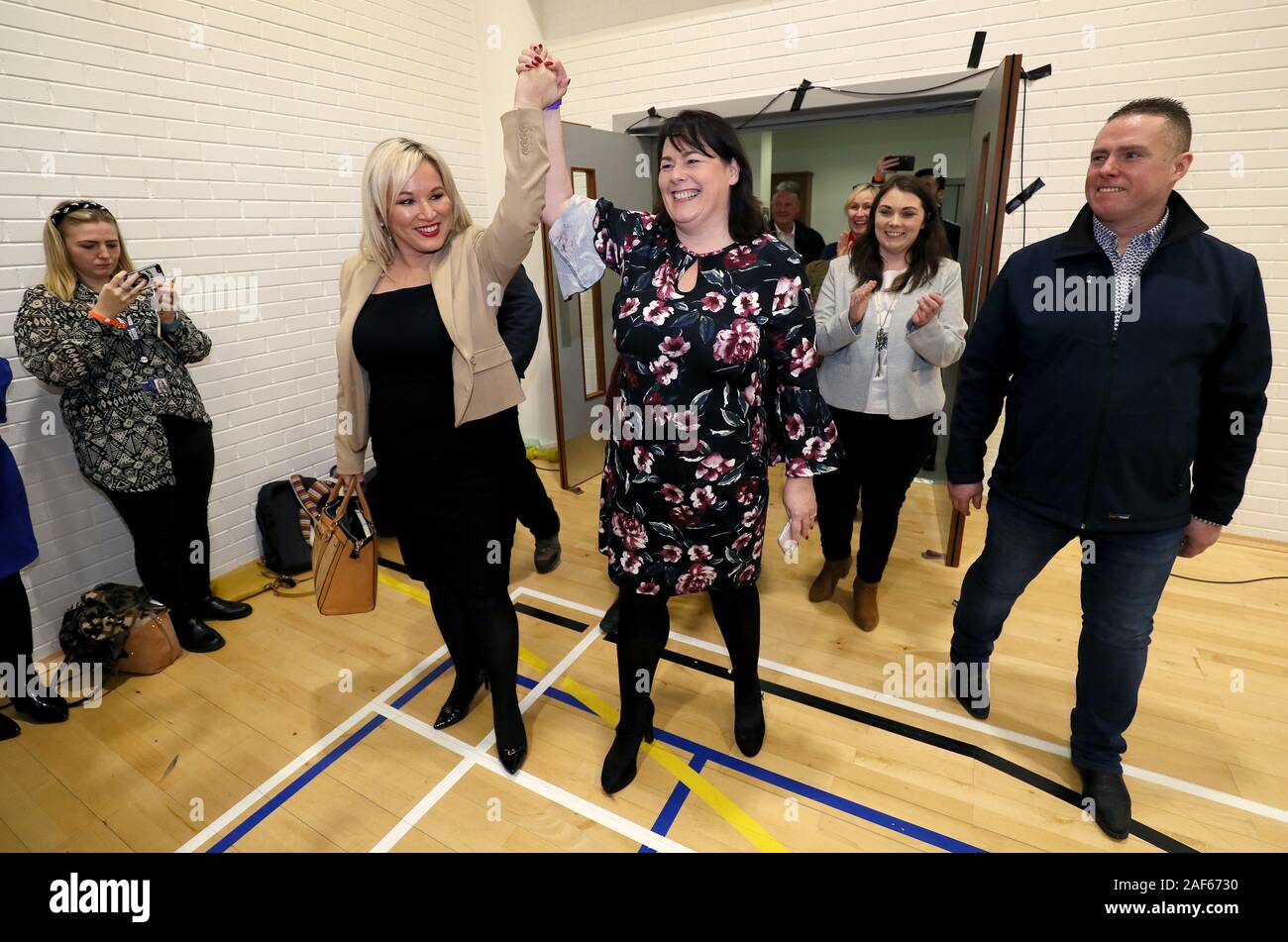 Sinn Fein candidate for Fermanagh/South Tyrone Michelle Gildernew (centre) celebrates with deputy leader Michelle O'Neill (second left) after she was announced as elected at the Leisure Centre, in Omagh, Northern Ireland, as counting continues in the 2019 General Election. Stock Photo