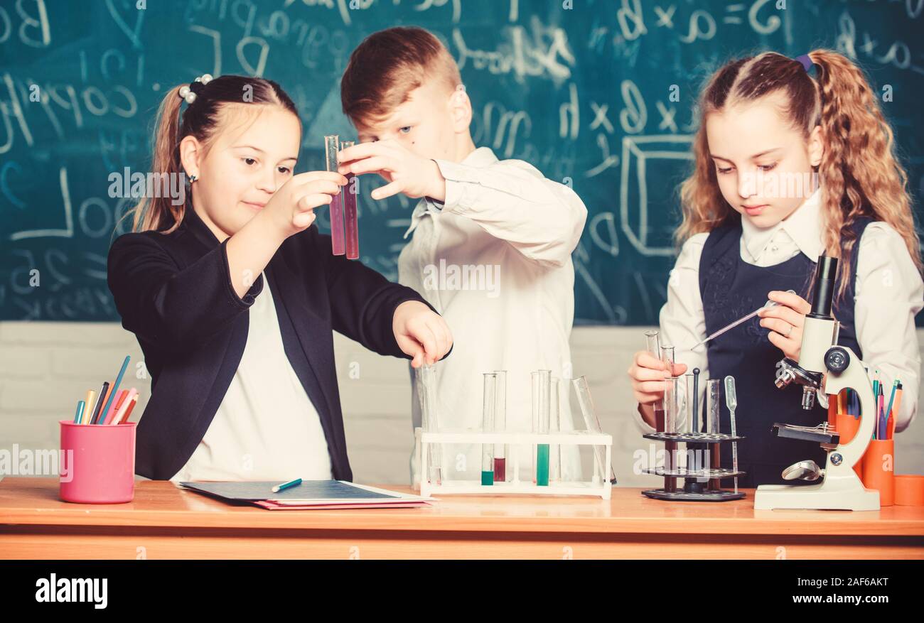 Chemistry science. Little kids scientist earning chemistry in school lab. biology experiments. Little children. Science. Lab microscope and testing tubes. Breathing life into chemistry. Stock Photo