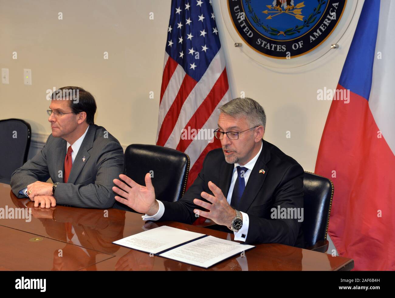 Czech Defence Minister Lubomir Metnar, right, and U.S. Defense Secretary Mark Esper, left, signed an inter-government deal on the Czech purchase of 12 military helicopters worth 14.6 billion crowns, supplied by the Bell company, in Washington, USA, on December 12, 2019. In the Czech military equipment, the helicopters will replace the outdated Russian combat helicopters Mi-24/35. The Czech air force will acquire eight UH-1Y Venom multipurpose helicopters and four AH-1Z Viper combat helicopters. The supply is scheduled for 2023. (CTK Photo/Karel Capek) Stock Photo