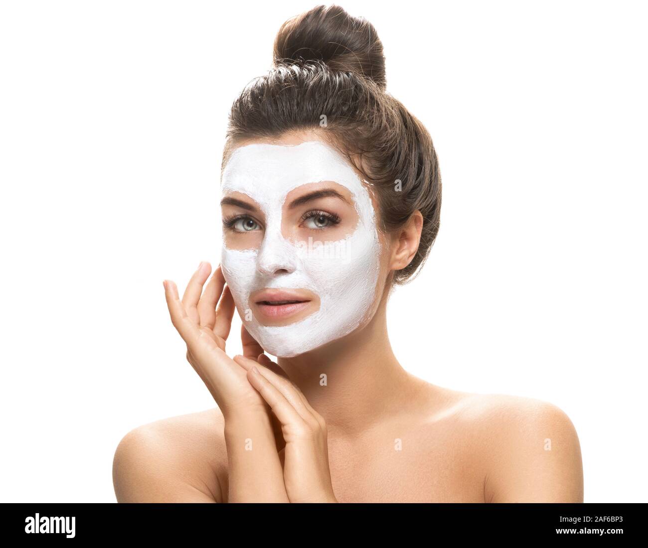 Beautiful woman with facial mask on white background. Skincare and