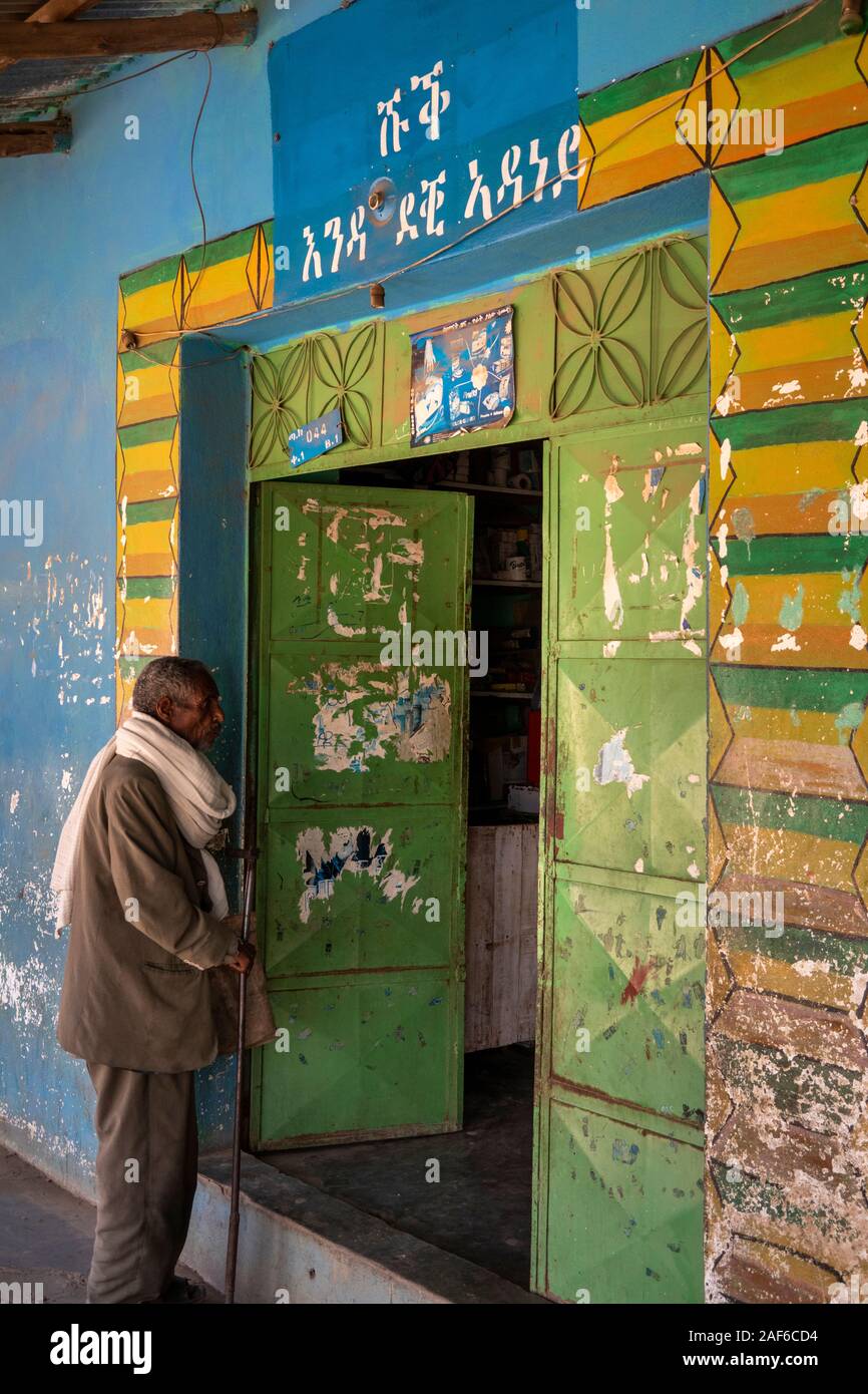 Ethiopia, Tigray, Axum (Aksum), old quarter, Daero Square, city centre, man begging at doorway outside small store Stock Photo