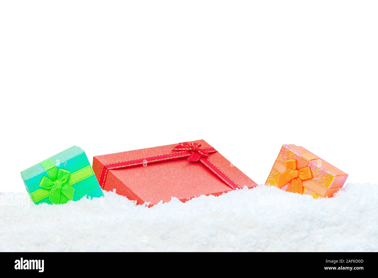 Three gift boxes in snow white background Stock Photo