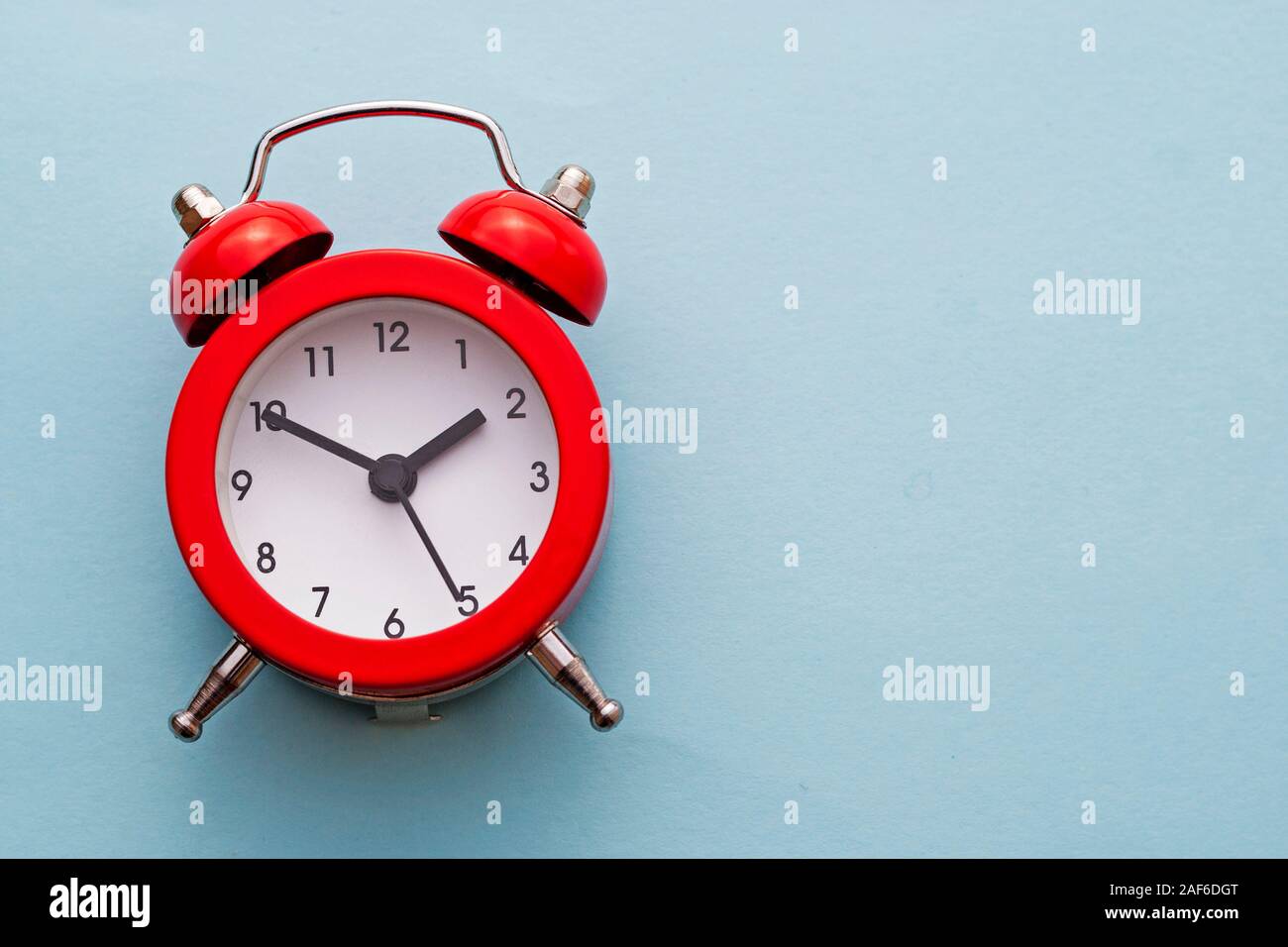 Colorful red traditional alarm clock with bells Stock Photo Alamy