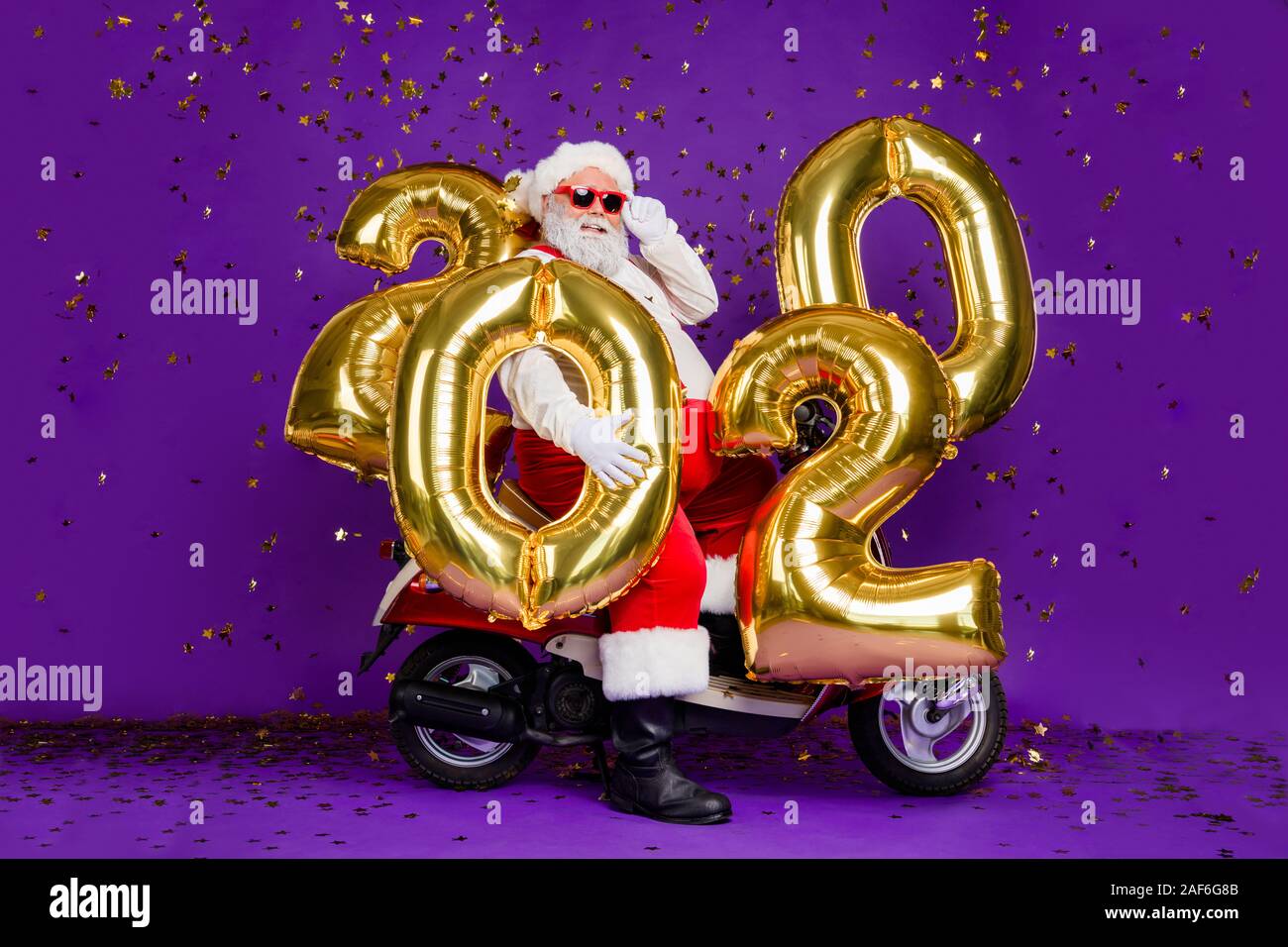 Full body photo of fat santa man sitting on bike holding big air ...