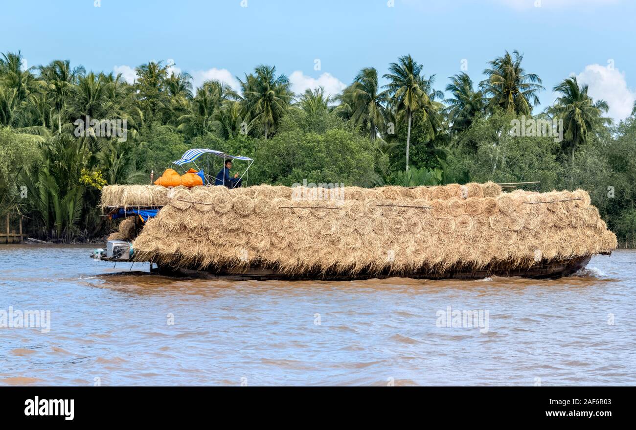 Overloaded traditional boat mekong delta hi-res stock photography and ...