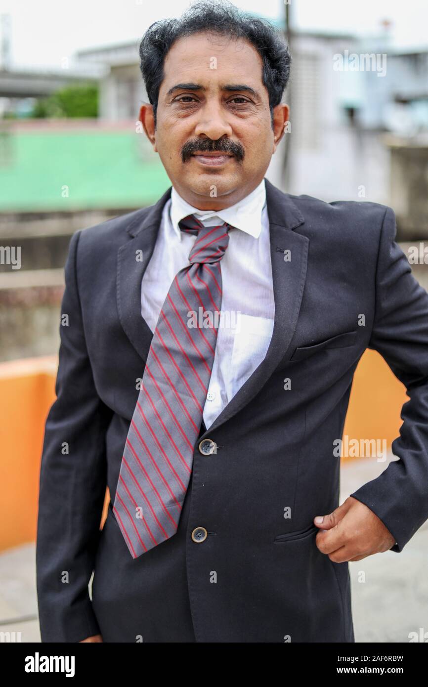 Confident businessman posing in the outdoors Stock Photo - Alamy