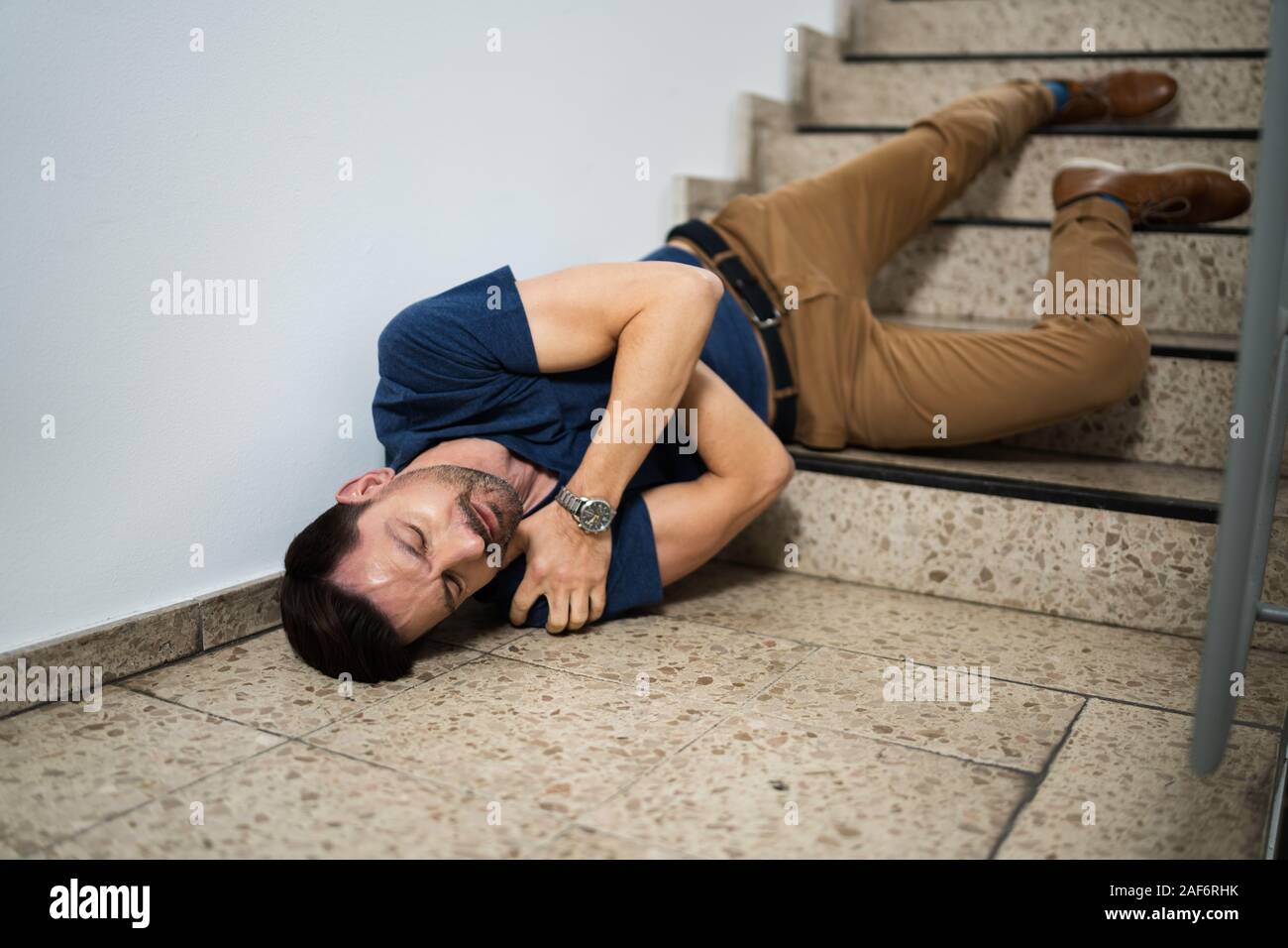 Unconscious Man Lying On Staircase After Slip And Fall Accident Stock ...