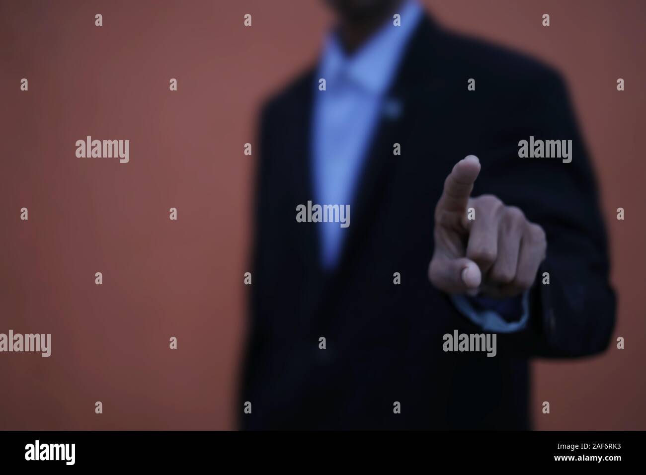 Businessman hand touching virtual screen, modern background concept Stock Photo