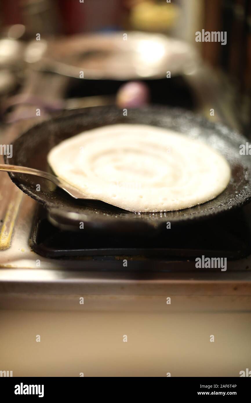 Dosa Indian food. cooking of Dosa in kitchen, India. South Indian