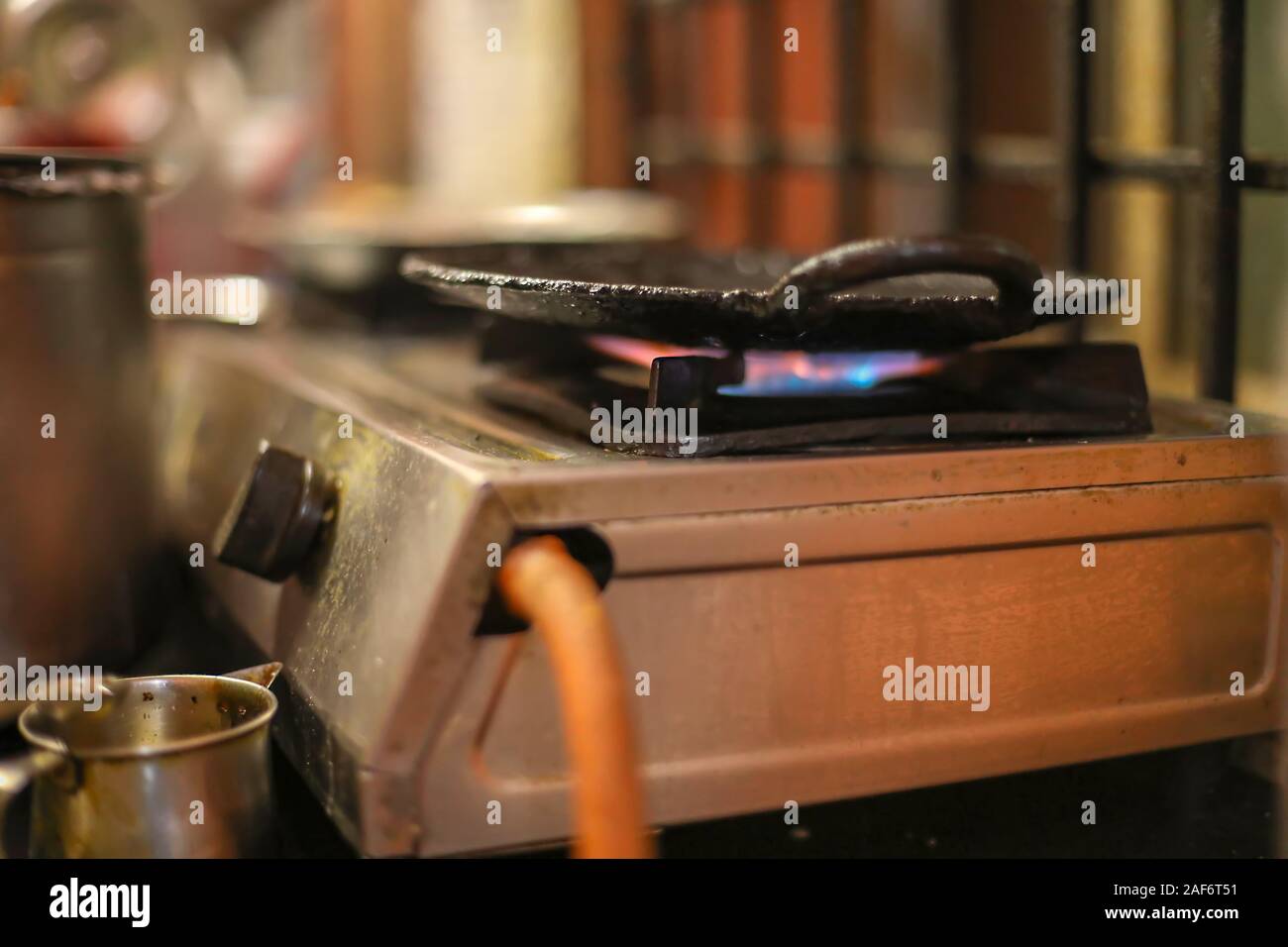 cooking Dosa in kitchen, India. South Indian vegetarian Stock Photo - Alamy