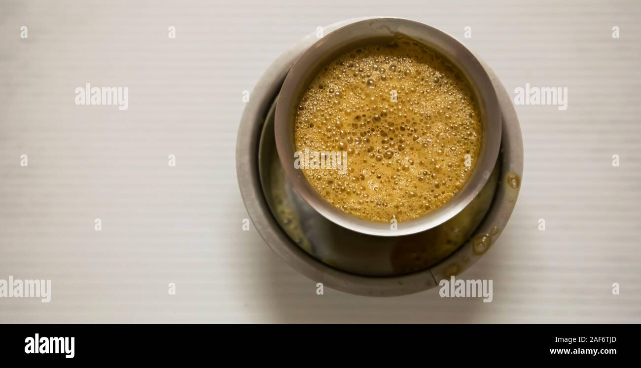 Indian filter coffee is famous coffee in steel cup. Top view Stock Photo -  Alamy