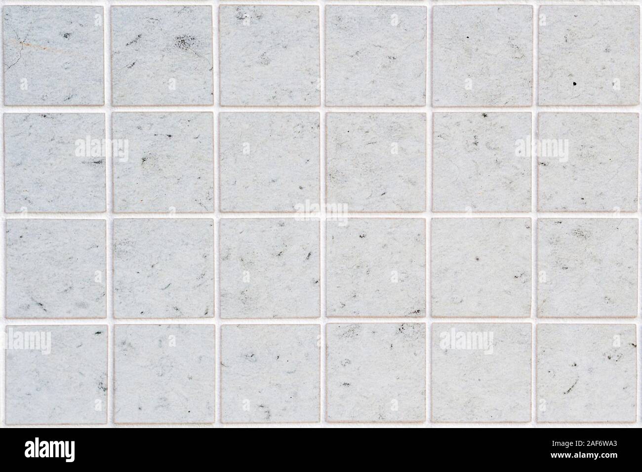 dirty white concrete wall tile with 24 squares in rectangular form Stock Photo