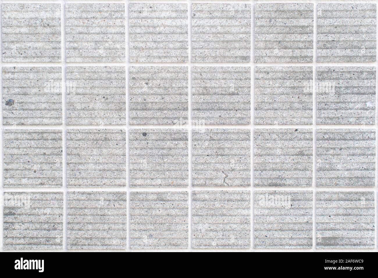 dirty white concrete wall tile with 24 squares in rectangular form Stock Photo