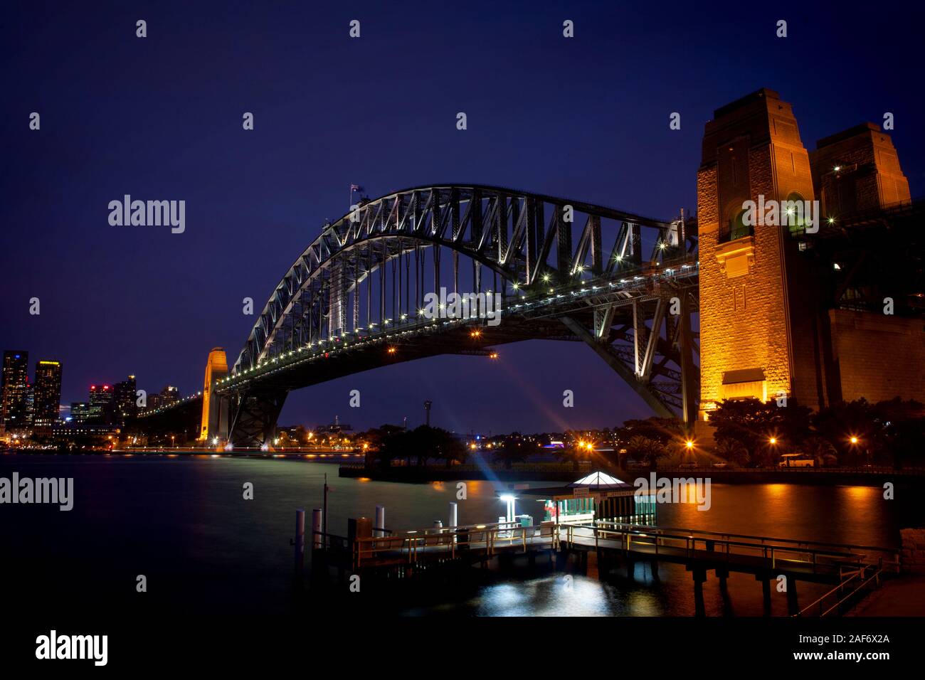 Sydney Harbour Bridge at night, from Jeffrey Street ferry stop at Milsons Point on the North Shore, Sydney, Australia Stock Photo