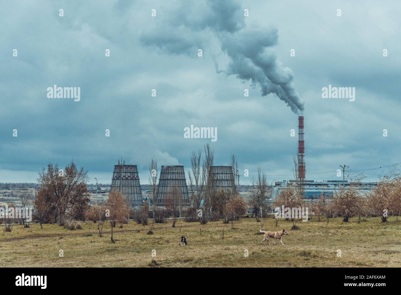 of large pipes belching smoke from thermal power plants Stock Photo