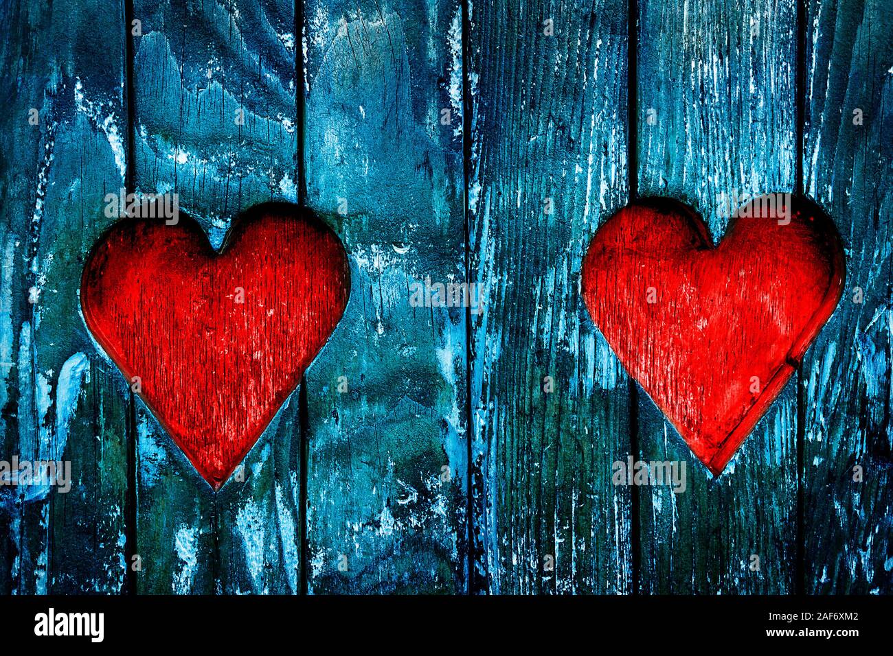 Architecture detail - love Valentines hearts Carved in old Wood. Stock Photo