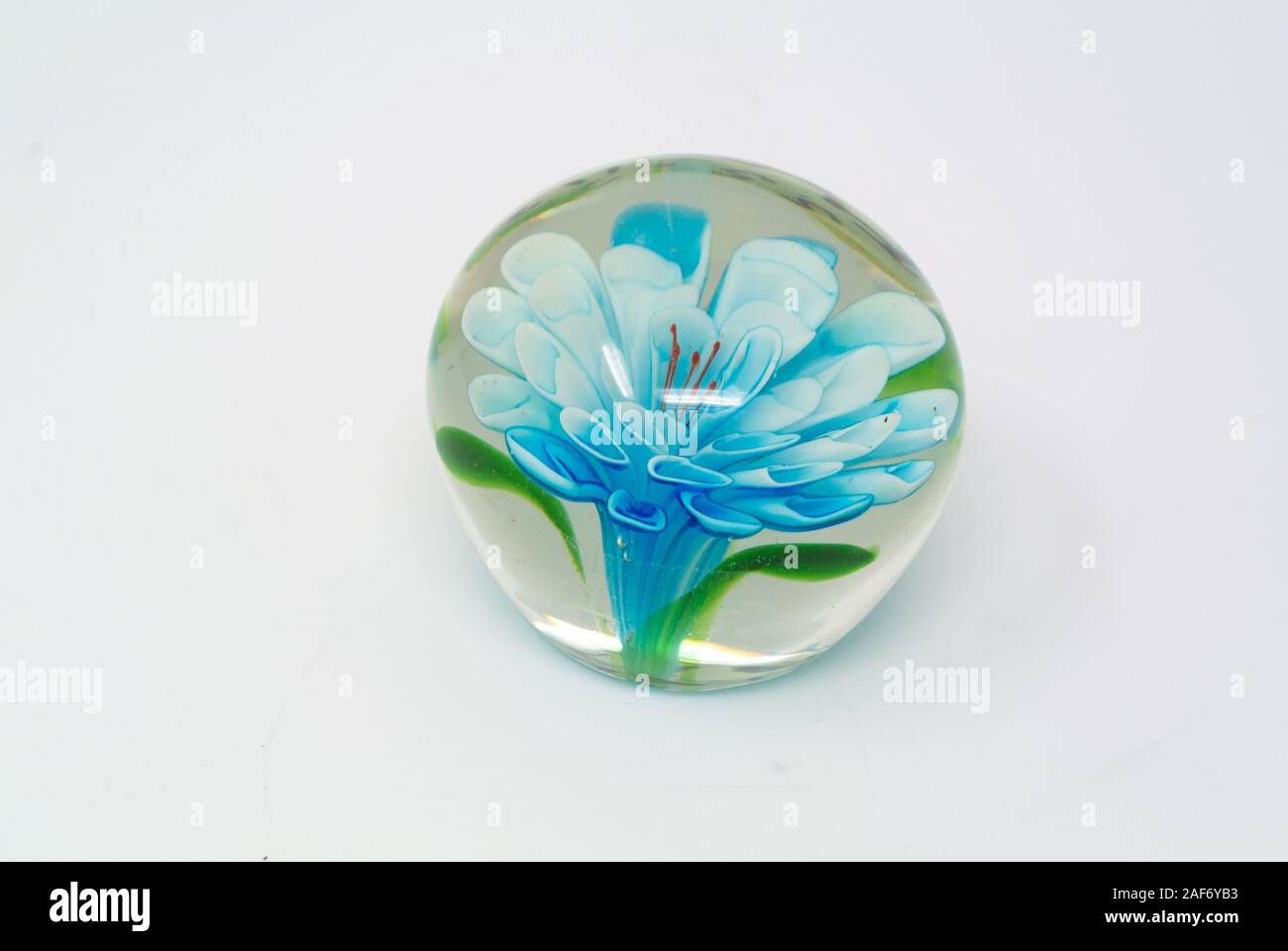 paperweight with blue flower with white background Stock Photo