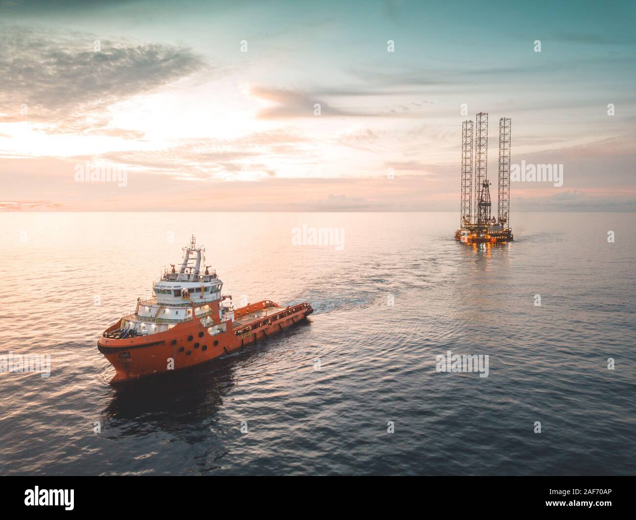 Aerial image during rig move operation in offshore oil field Stock