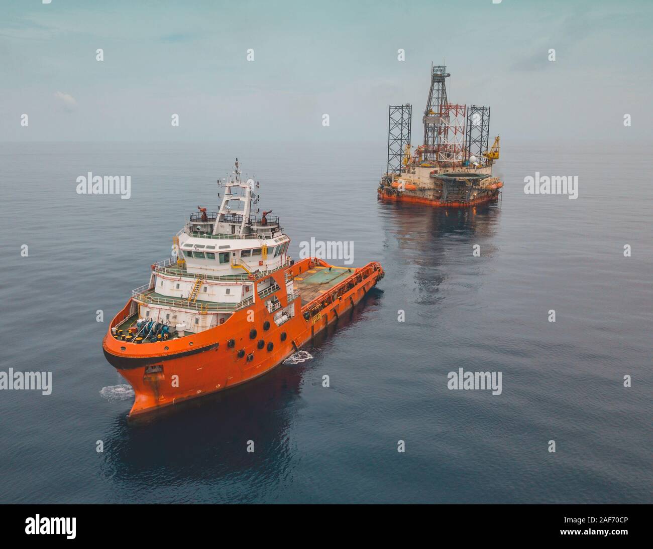Aerial image during rig move operation in offshore oil field Stock