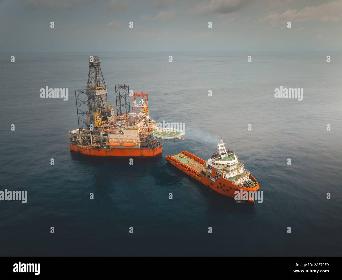 Aerial image during rig move operation in offshore oil field Stock