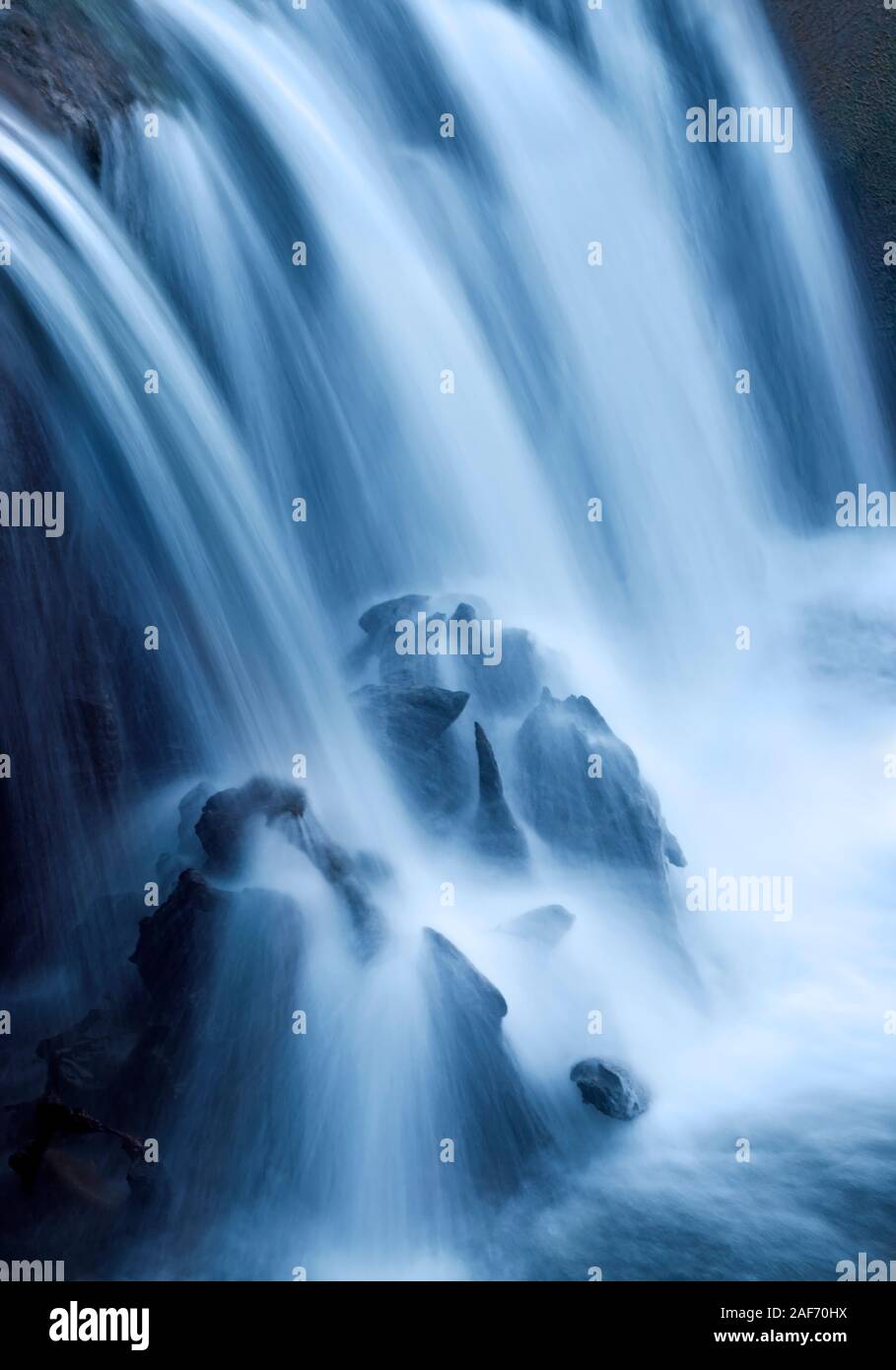 A gushing part of the picturesque Cenarth Falls in Wales. Stock Photo