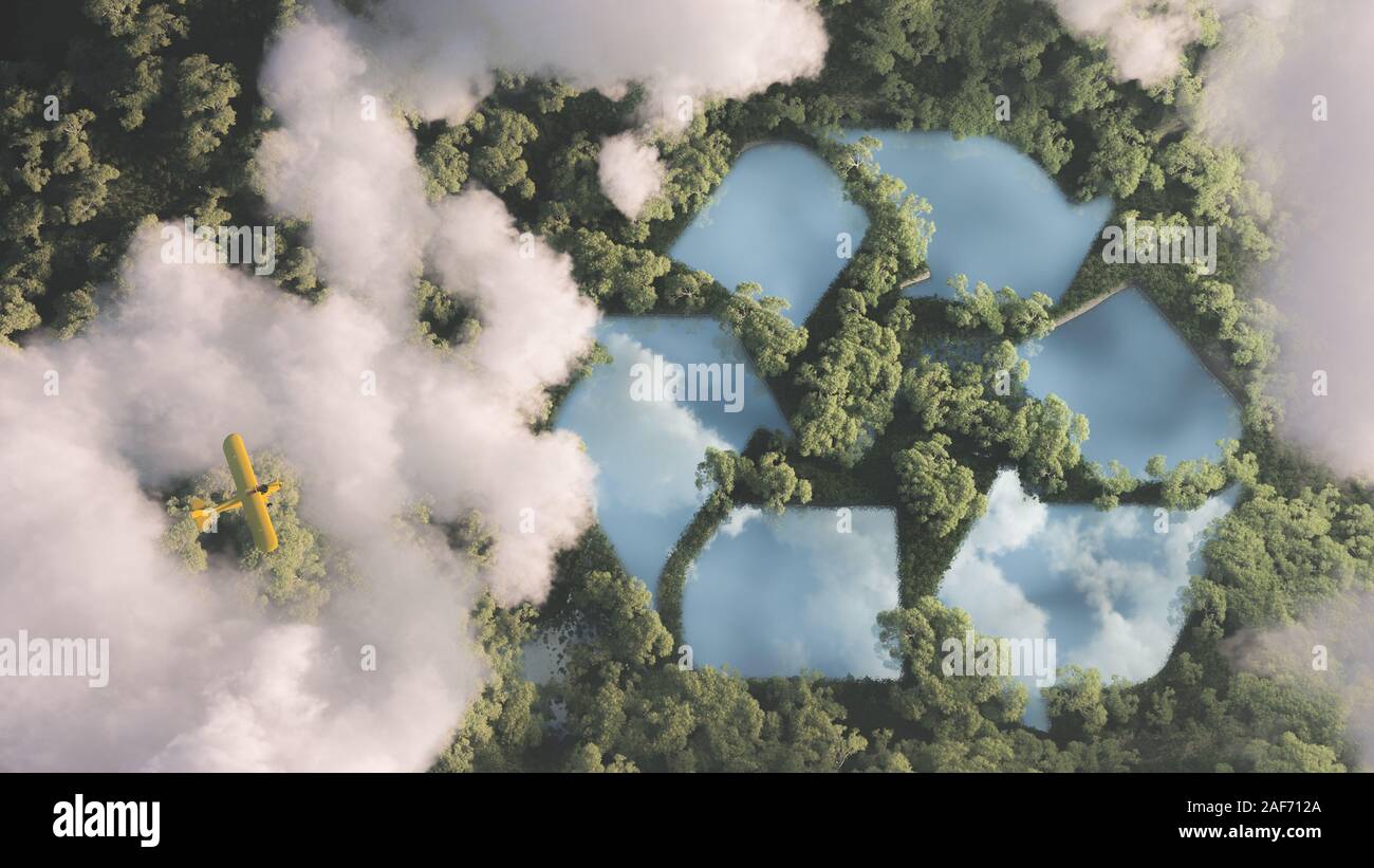 Eco friendly waste management concept. Recyclyling sign in a lake shape in the middle of dense amazonian rainforest vegetation viewed from high above Stock Photo