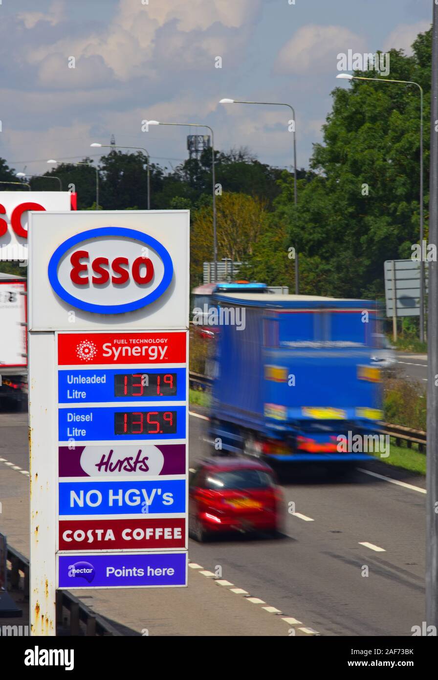 traffic passing esso garage forecourt by the A1/M motorway skellow yorkshire united kingdom Stock Photo