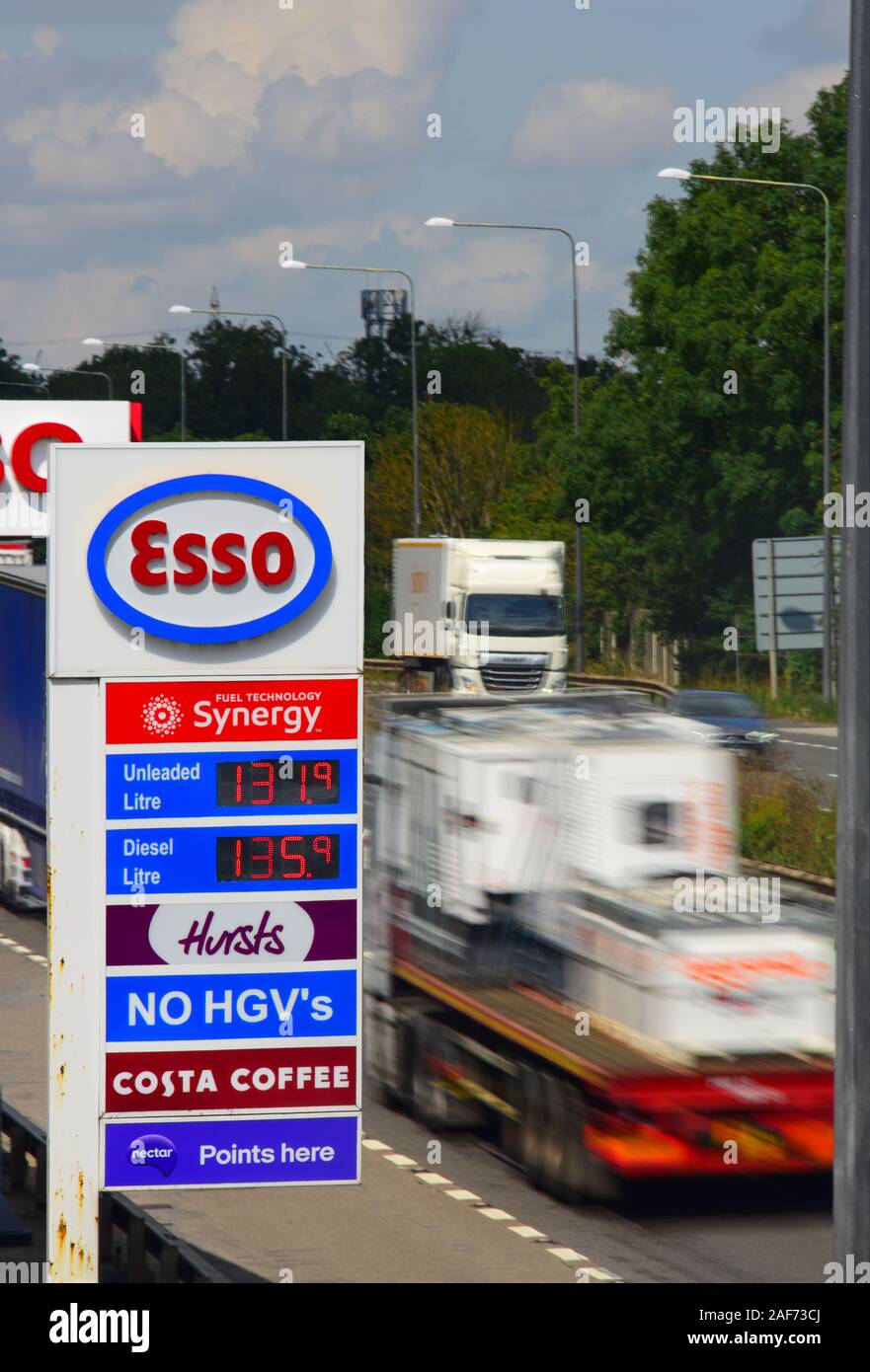 traffic passing esso garage forecourt by the A1/M motorway skellow yorkshire united kingdom Stock Photo
