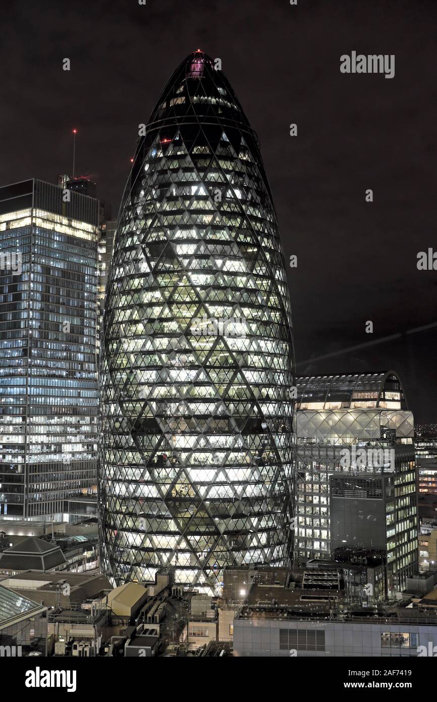 The Norman Foster & partners gherkin skyscraper building at night in the City of London cityscape London England UK   KATHY DEWITT Stock Photo