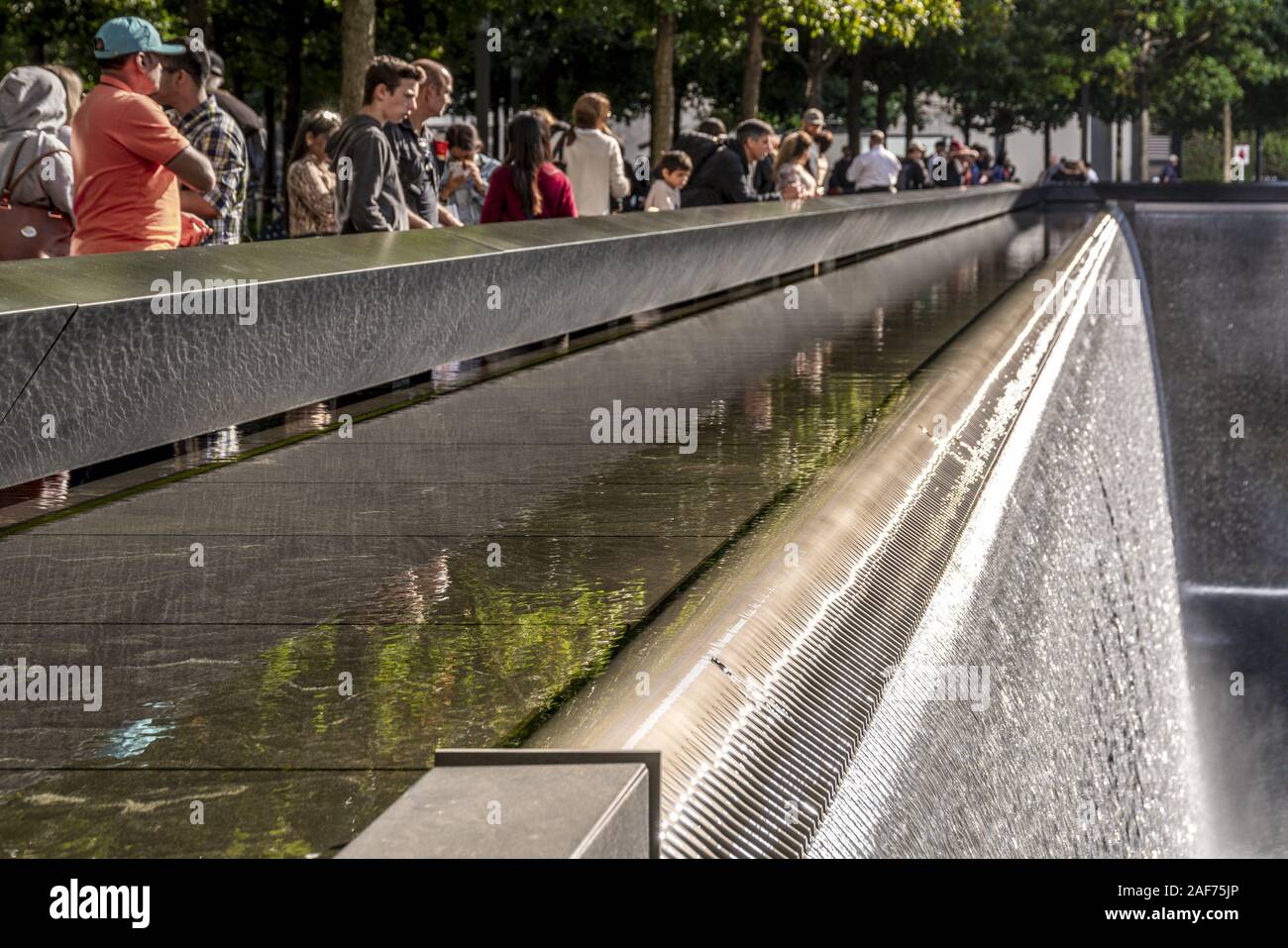 On the walls of the two basins of the 9/11 Memorial in New York the ...