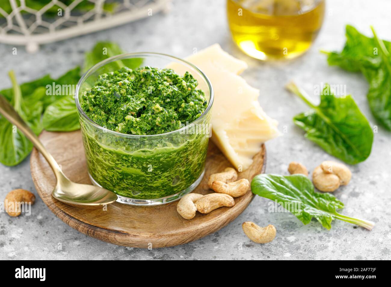 Spinach pesto sauce with cashew, parmesan cheese and olive oil Stock