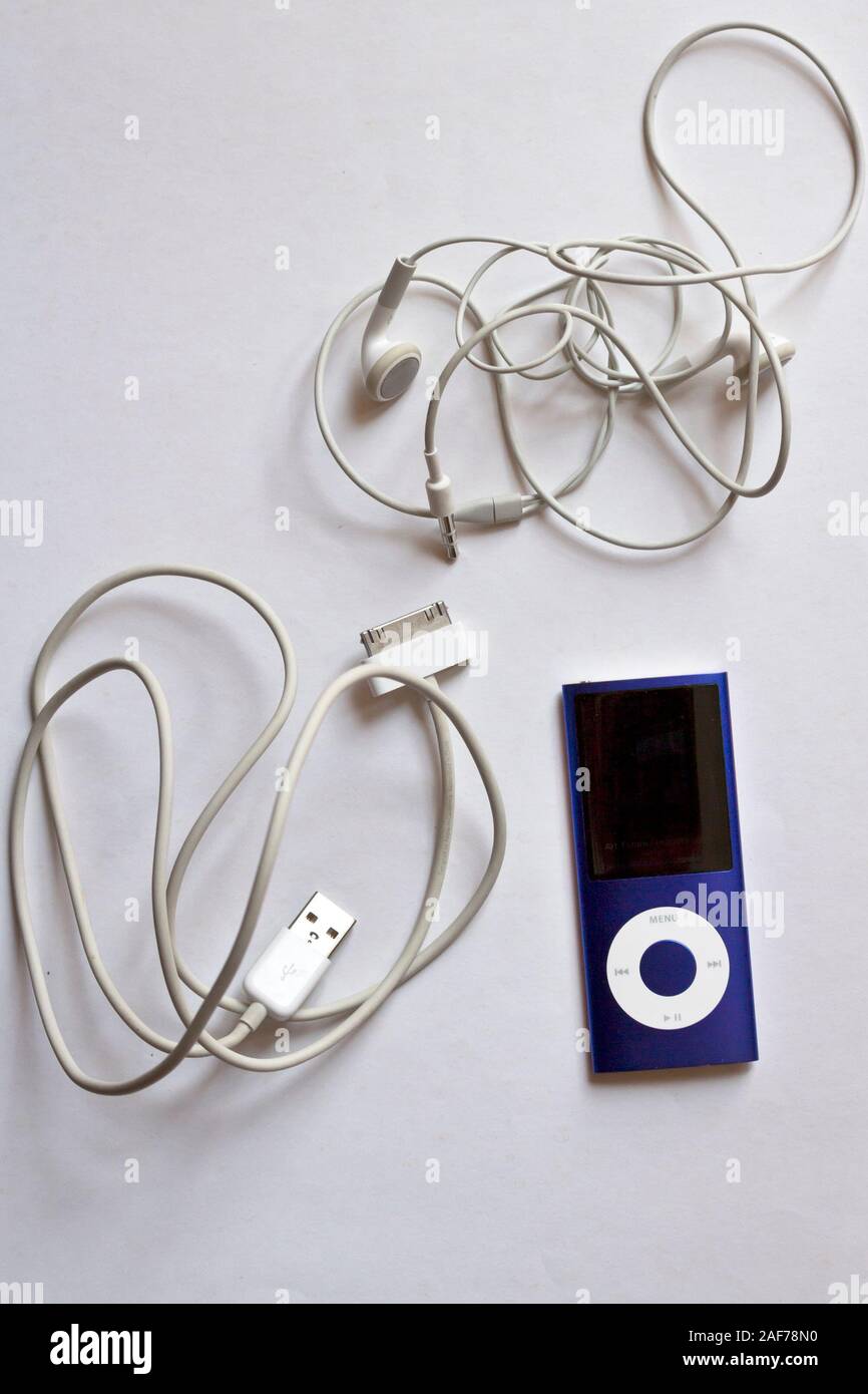 Milan, Italy - June 4, 2019. Blue Apple iPod Nano 8Gb Music Player isolated on white background with Apple earbuds and charger cable Stock Photo