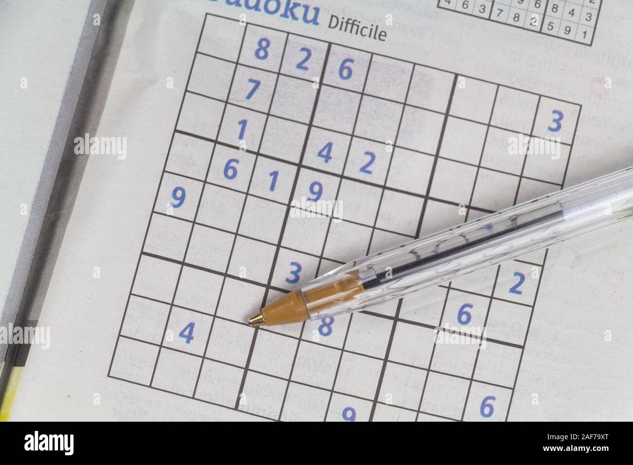Sudoku game in a newspaper and pen Stock Photo