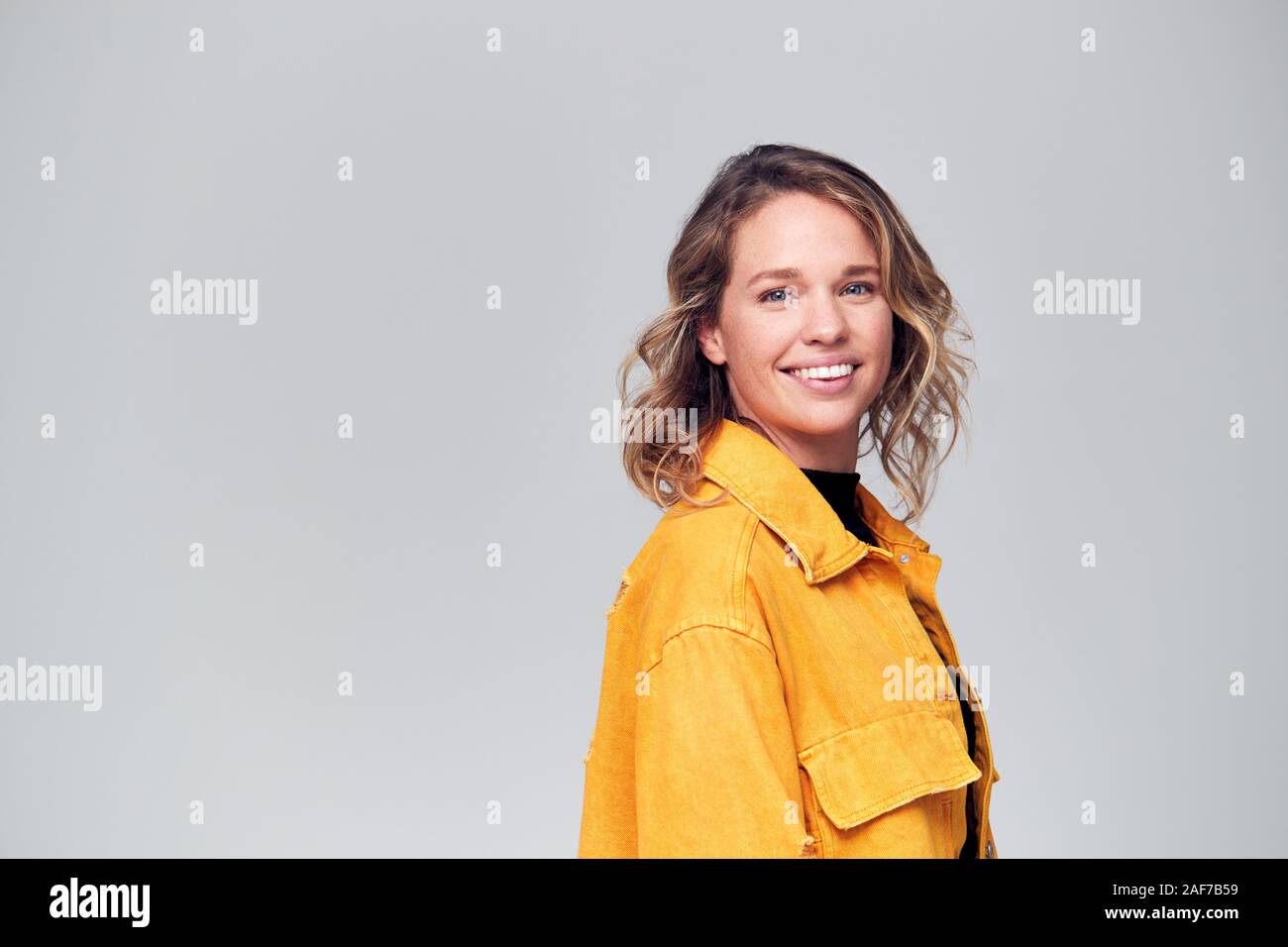Offset Smiling Offset Studio Portrait Of Positive Happy Young Woman Smiling Off Camera ...