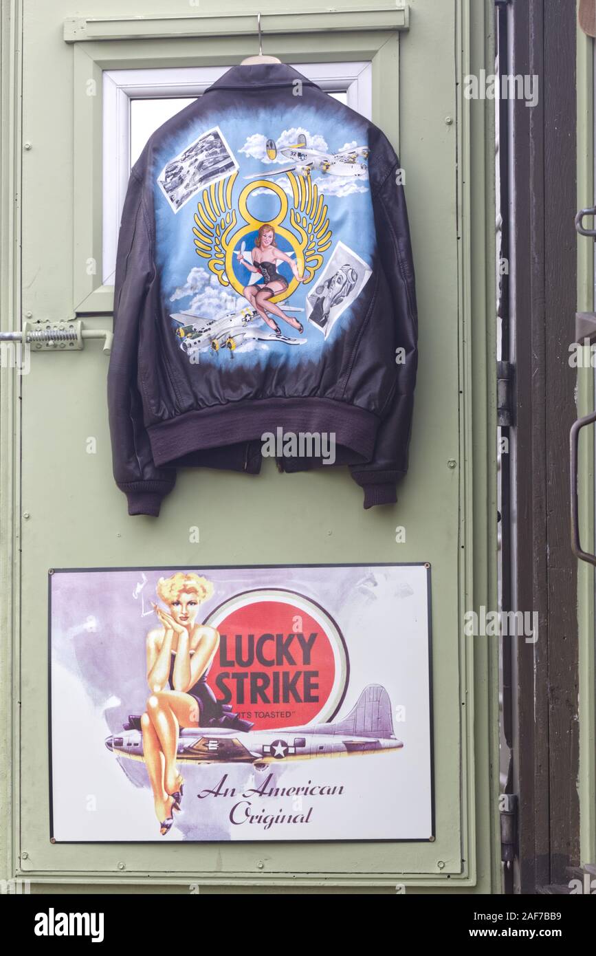 pin up girl on a  leather jacket and lucky strike poster Stock Photo